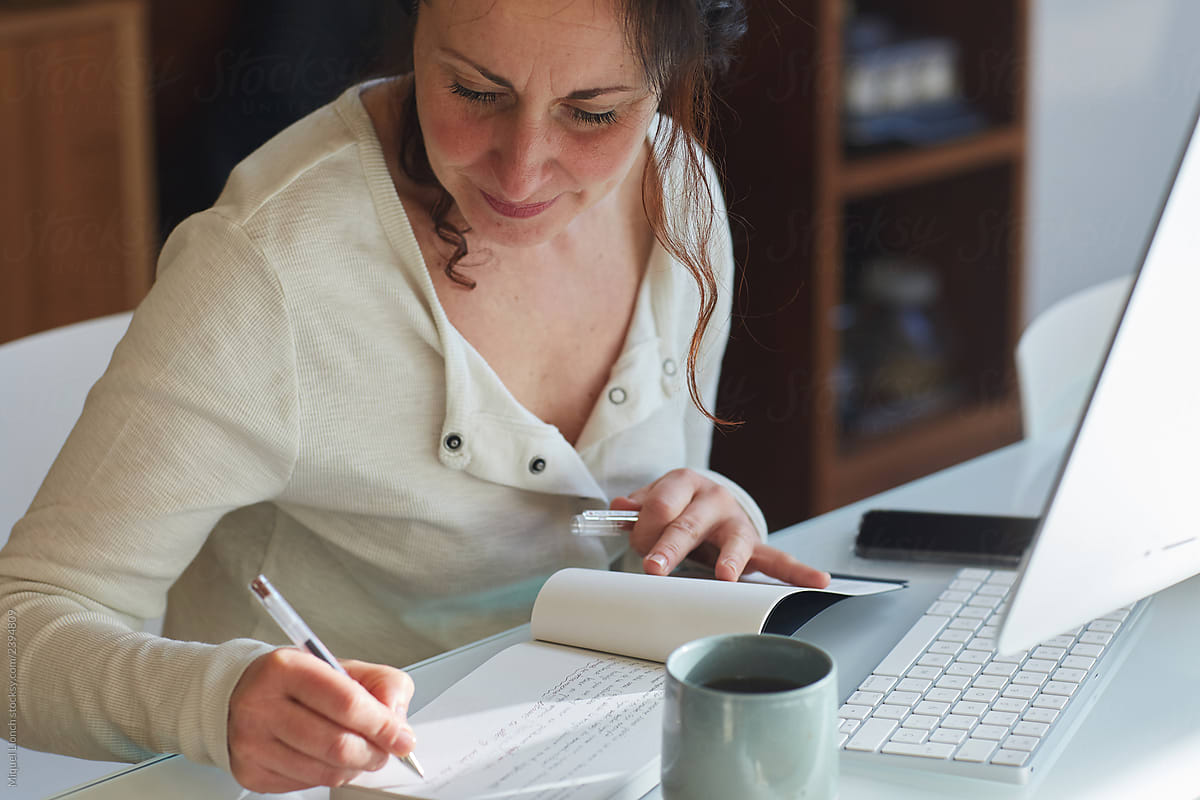 Woman hand writing at home