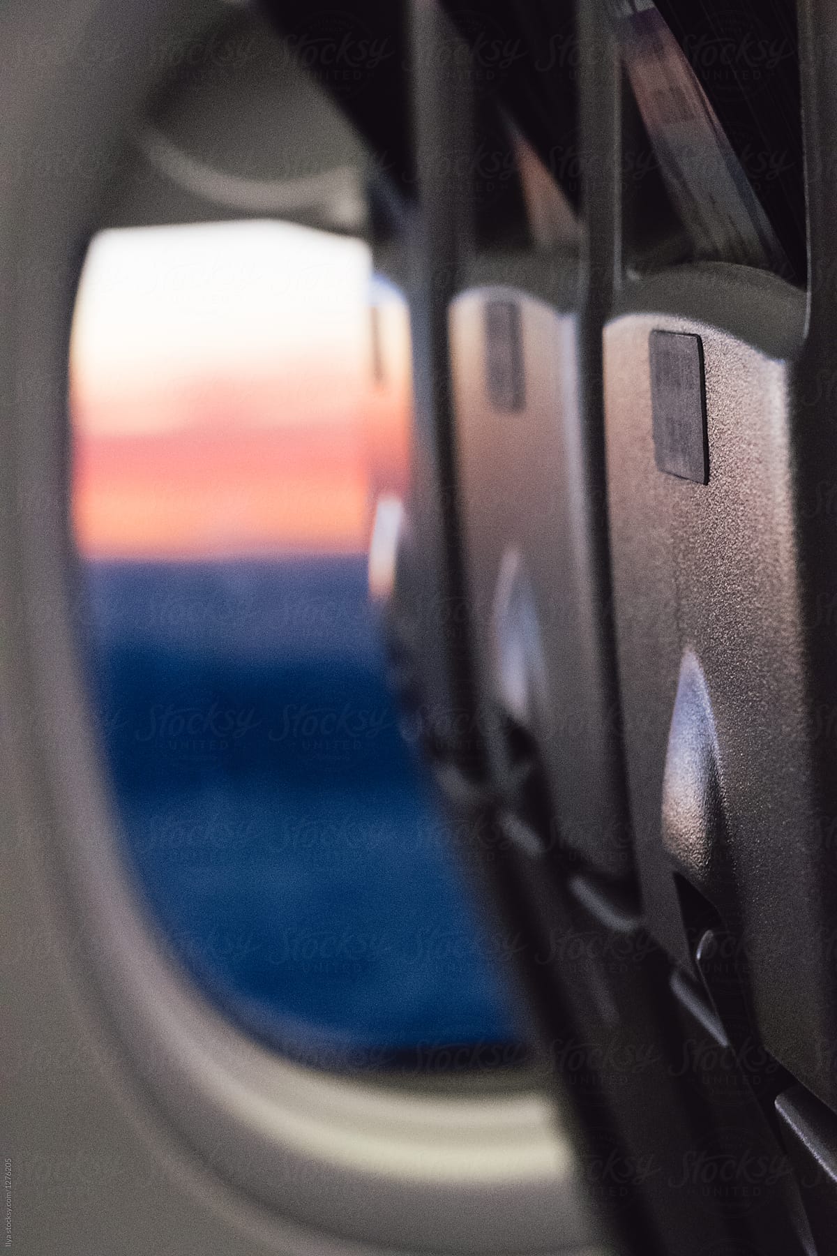 Travel fly plane inside cabin window sunset