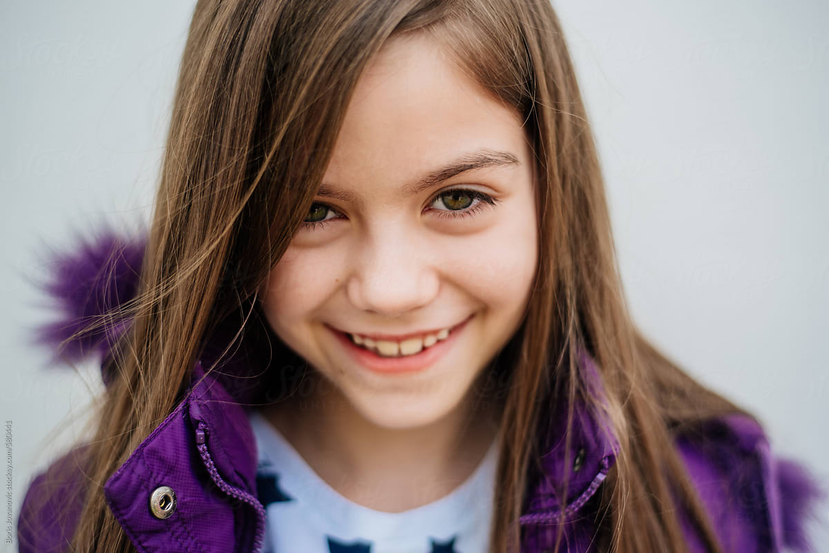 Young Girl Smiling At Camera By Stocksy Contributor Boris Jovanovic