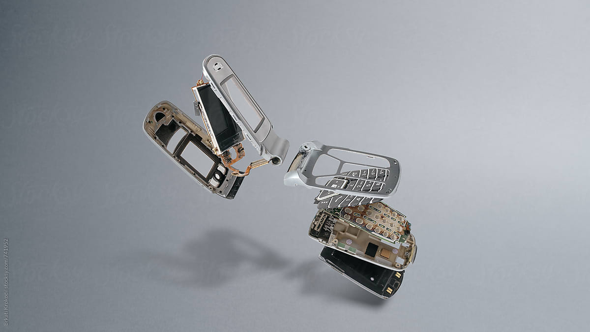 Disassembled Old Model Of Mobile Phone On Gray Background