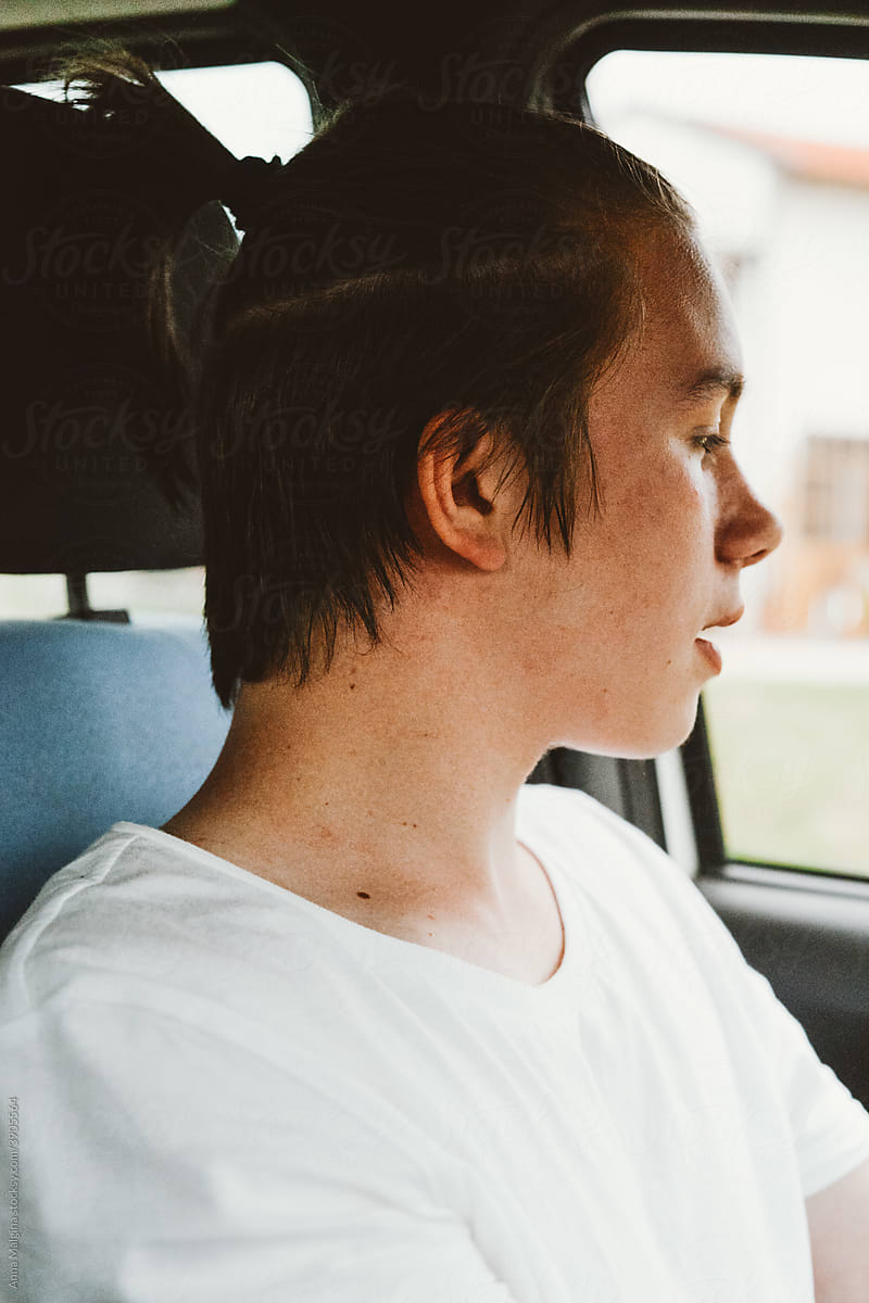 A young handsome man driving a car