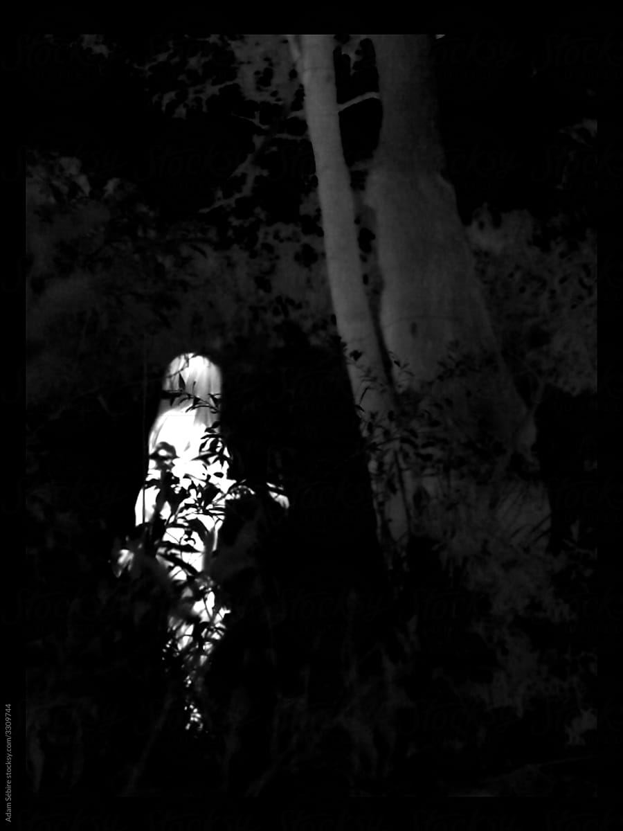 Thermographic thermal heat imaging of naked nude woman in forest environment at night