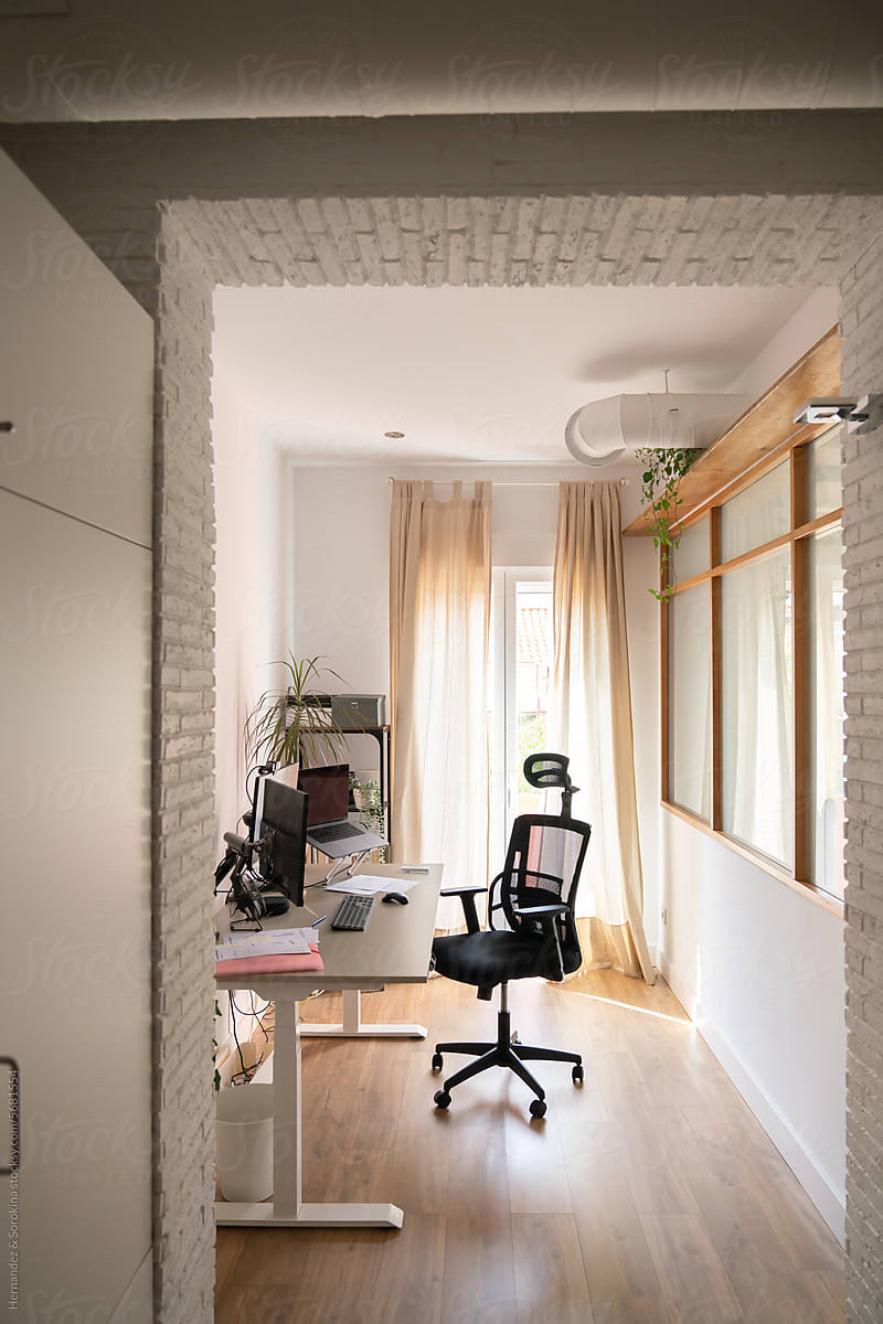 View Of Desk And Office Chair In Bright Room