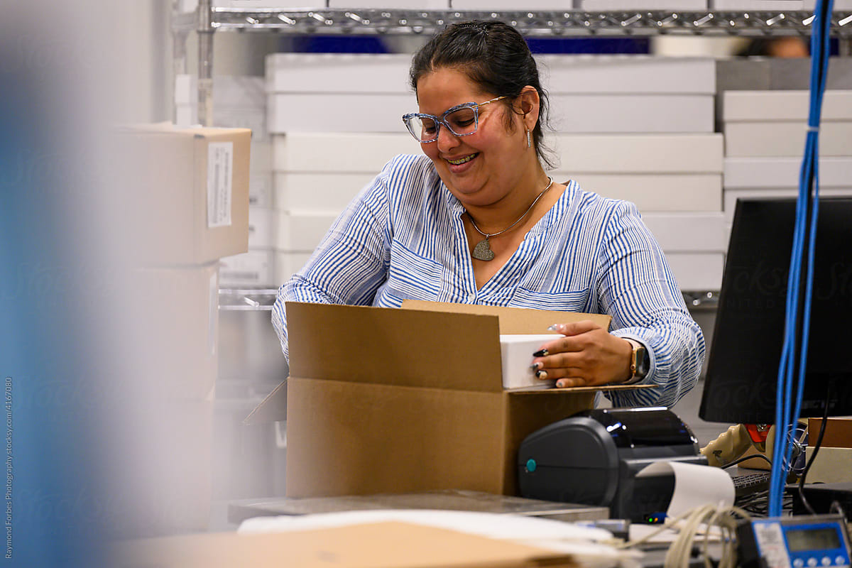 Hispanic Online Shopping worker at warehouse