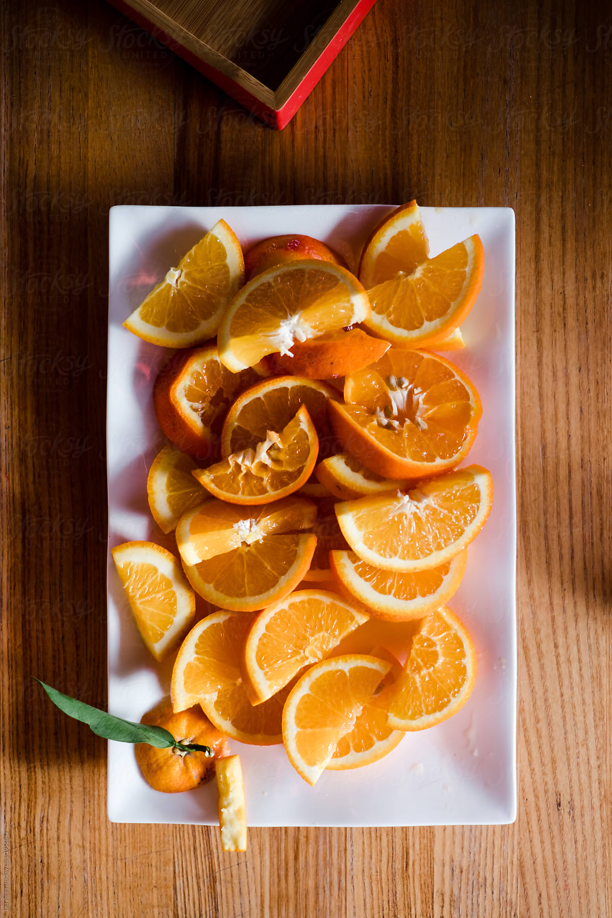 Cut up oranges on plate