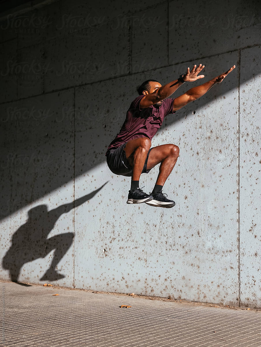 Black guy jumping during training