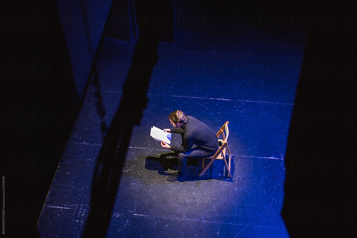 Actor reviewing script in stage.