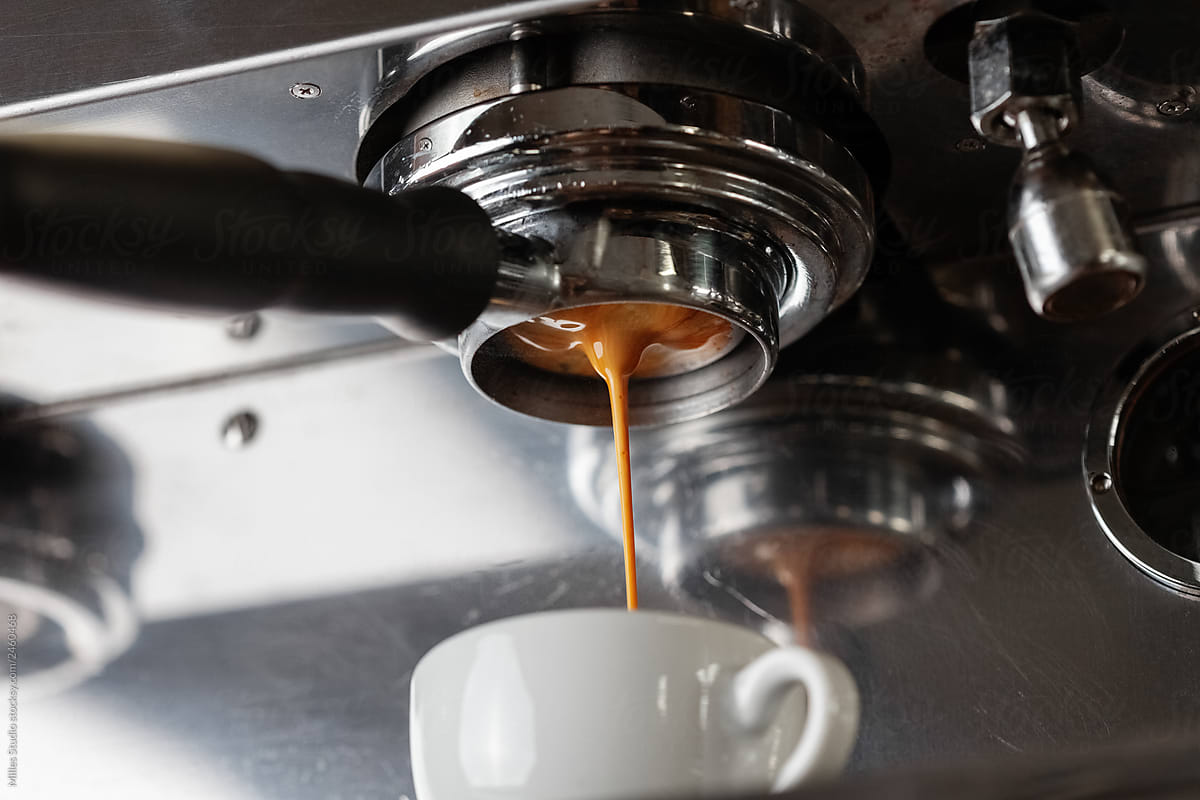 Dripping espresso from metal dispenser