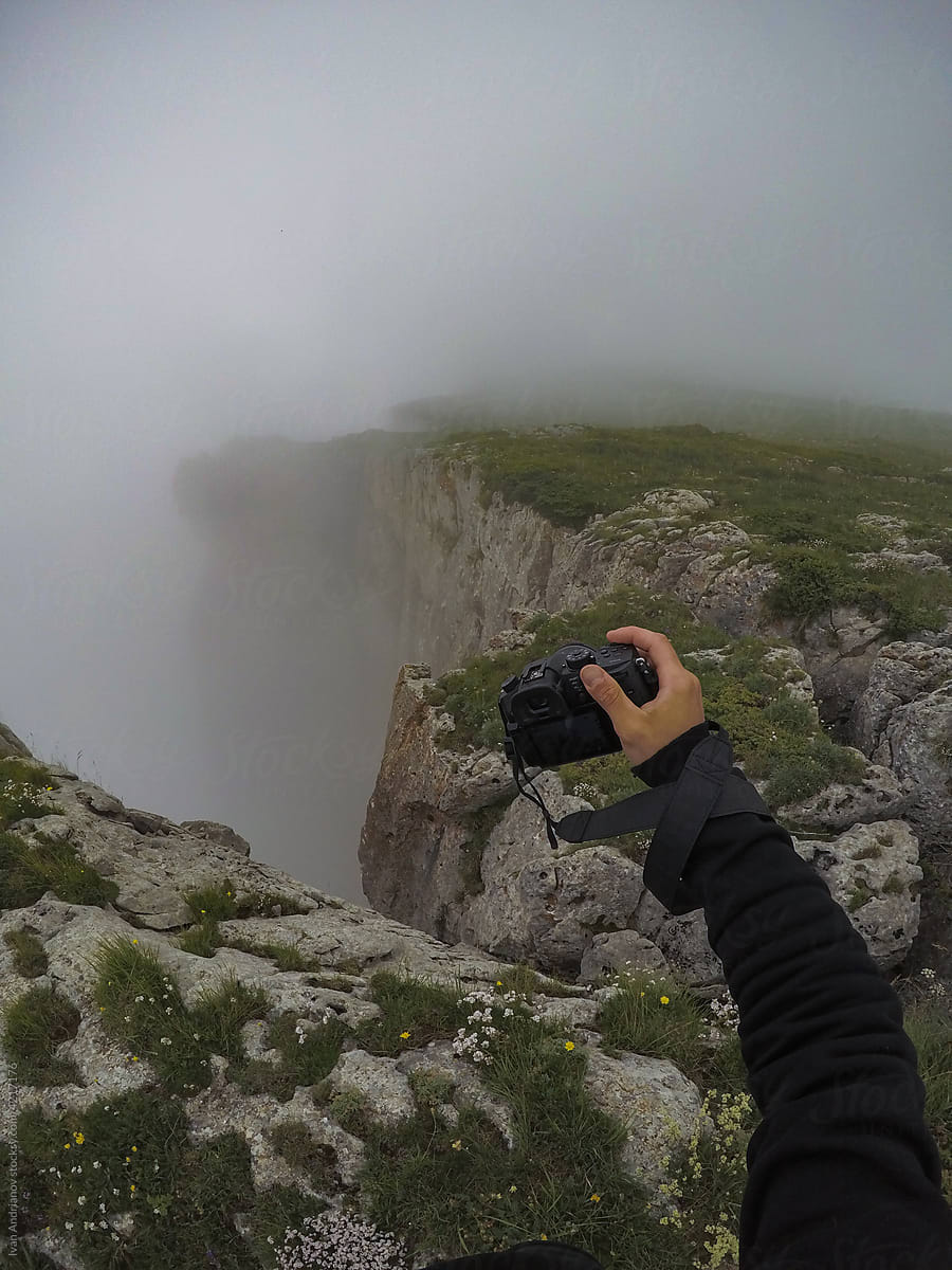 Traveling Photographer On Foggy Mountain Top