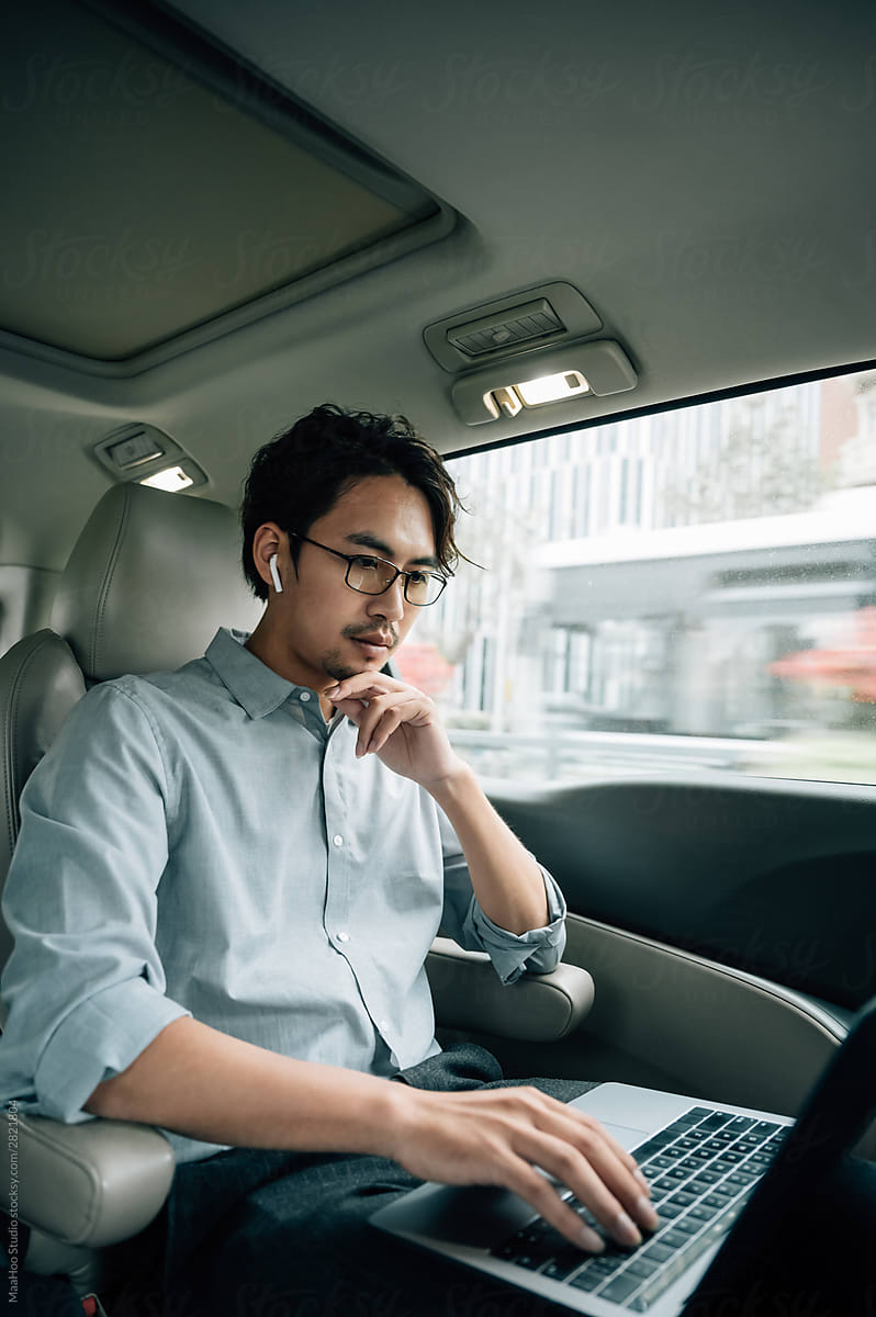 Businessman sitting in taxi