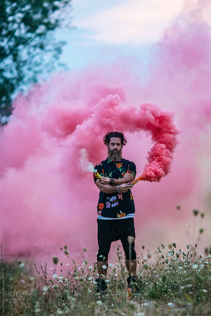mørke Afdeling forskel Fashionable Hipster Man Holding Red Smoke Bomb In Nature" by Stocksy  Contributor "Igor Madjinca" - Stocksy