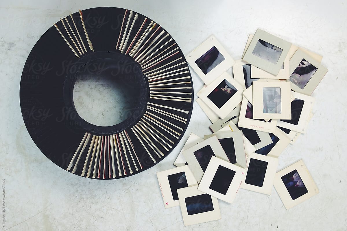 Vintage 35mm film slides on an old white table