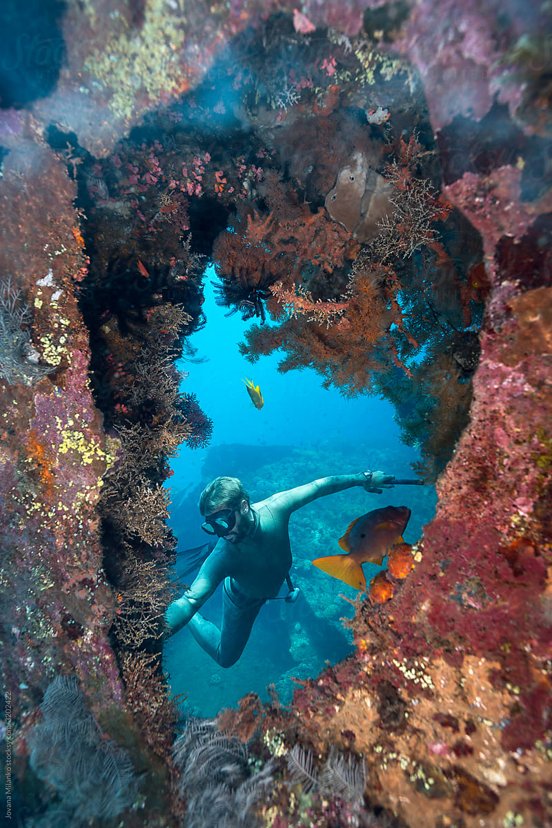 Freediver apnea diving on a shipwreck