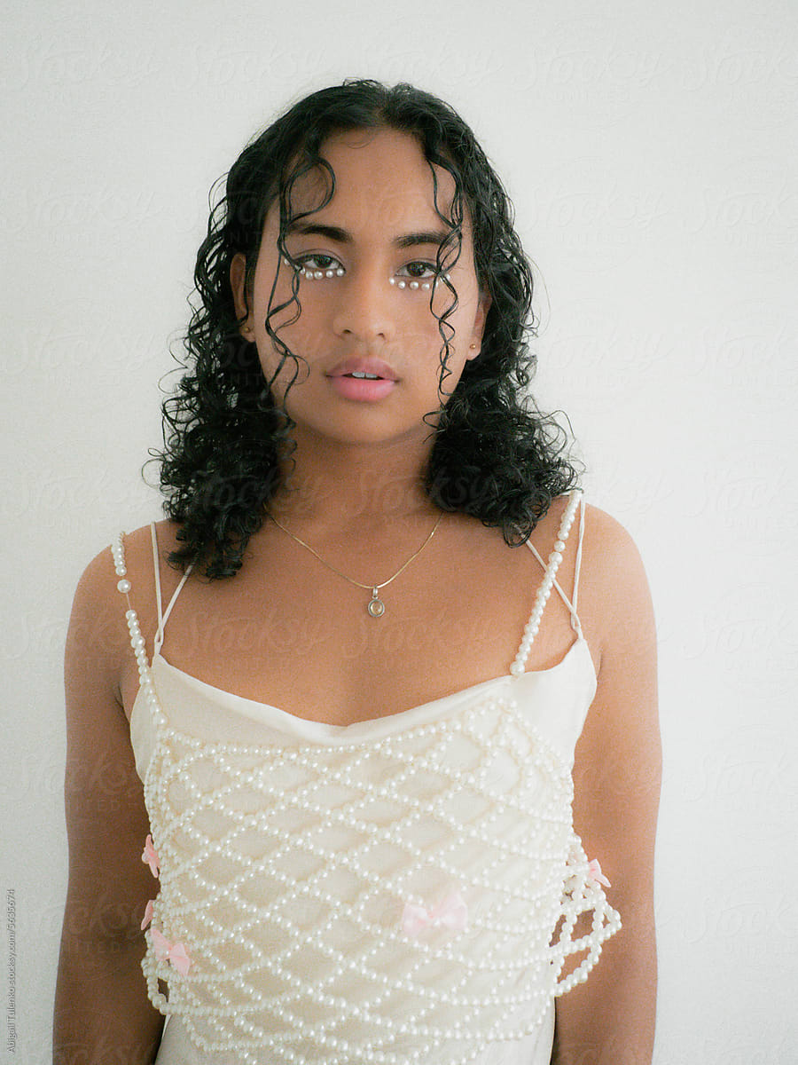 Model With Pearls Under Eyes in Pearl Dress