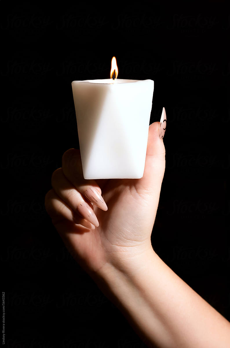 Woman Holding White Candle