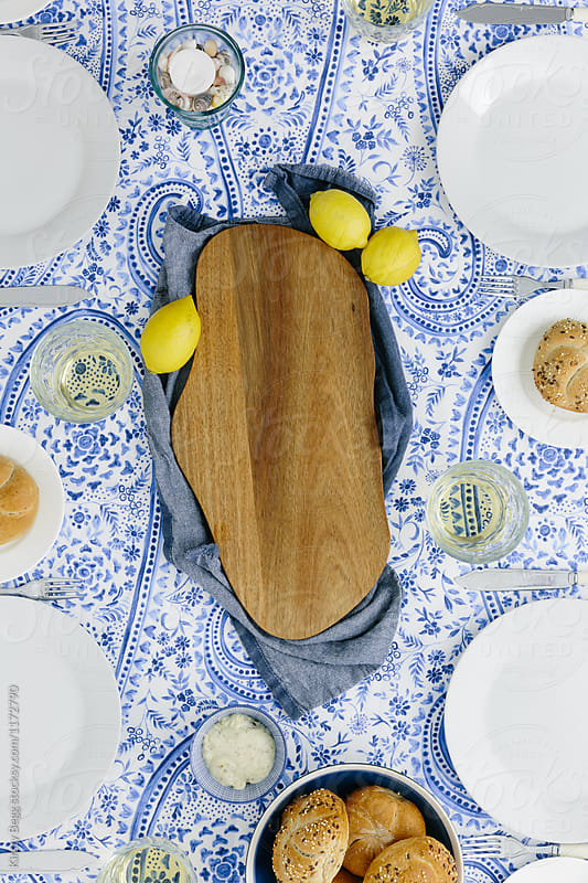Empty wooden platter on dinner table, copy space