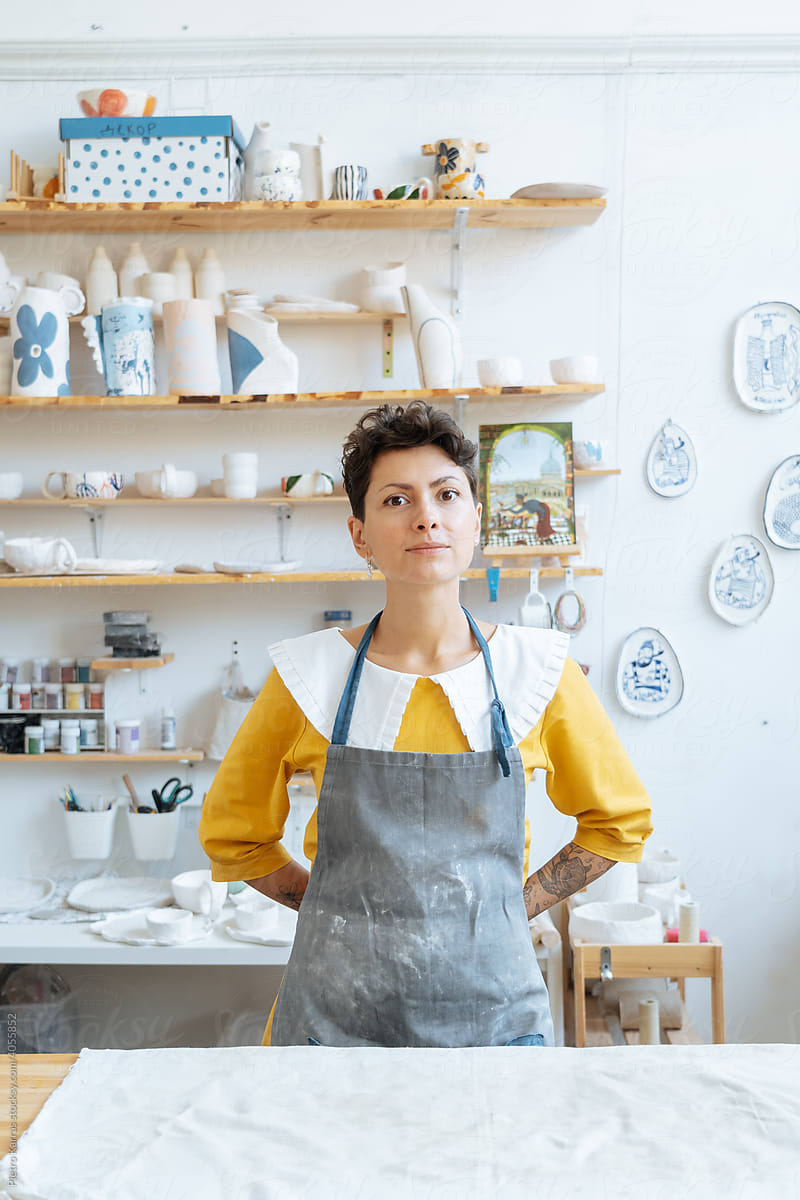 Young woman ceramist at her studio