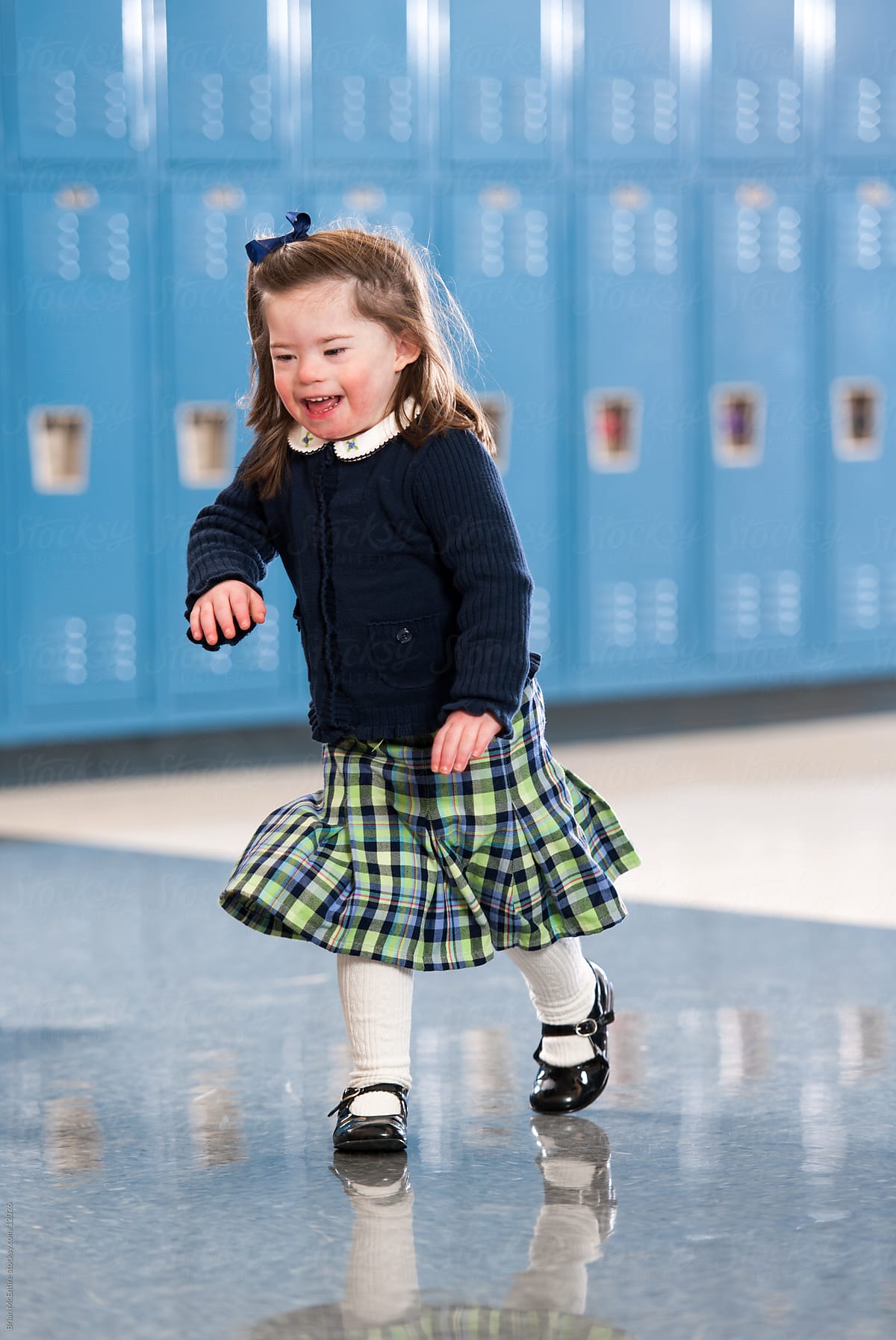 Kindergarten Girl with Down Syndrome Running Through School Halls