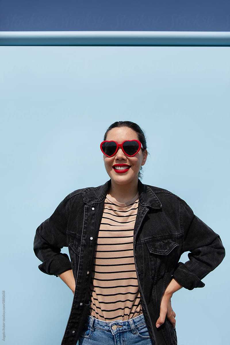 Woman in Denim Jacket and Sunglasses