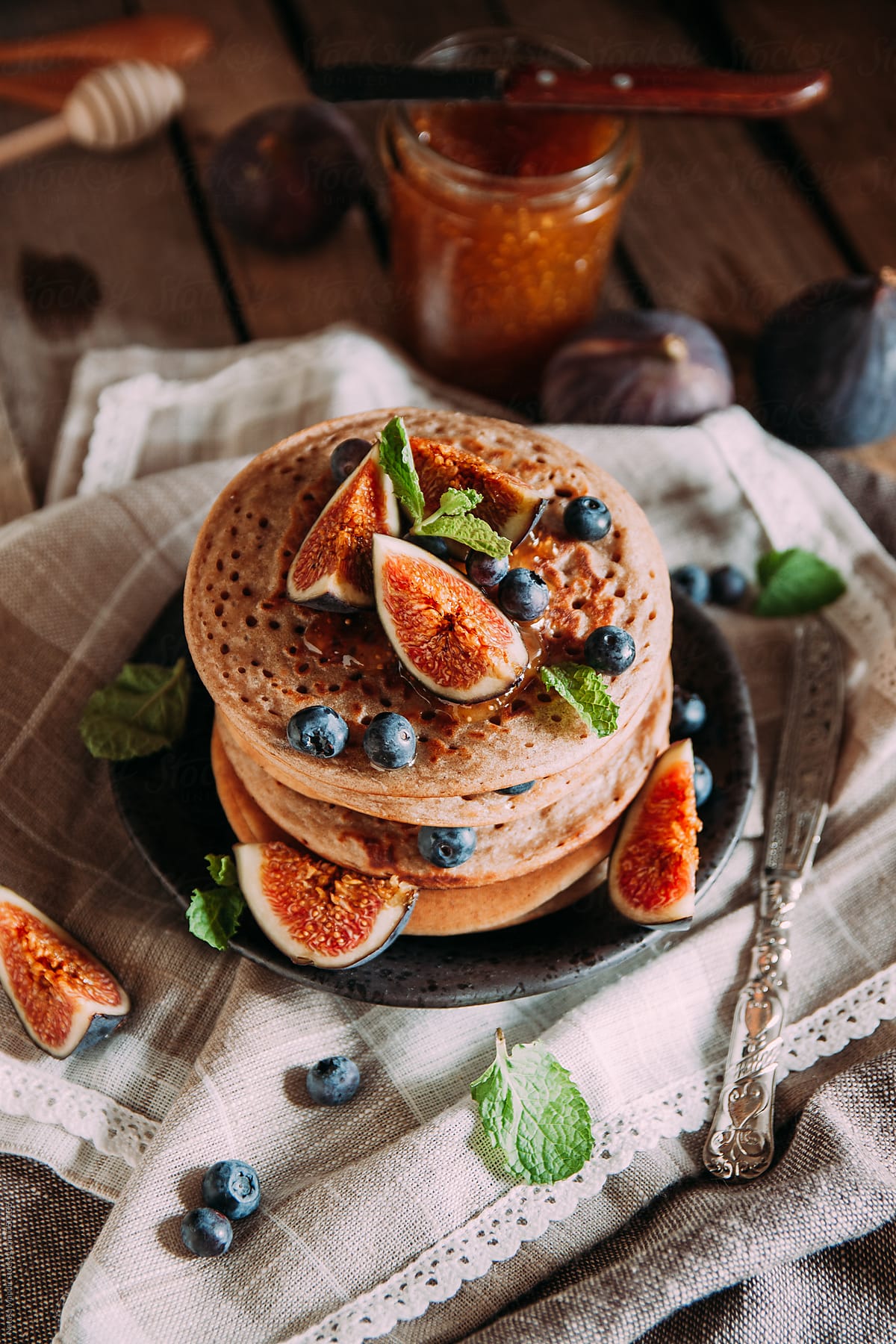 Delicious breakfast. Homemade pancakes with fresh figs and bluberries