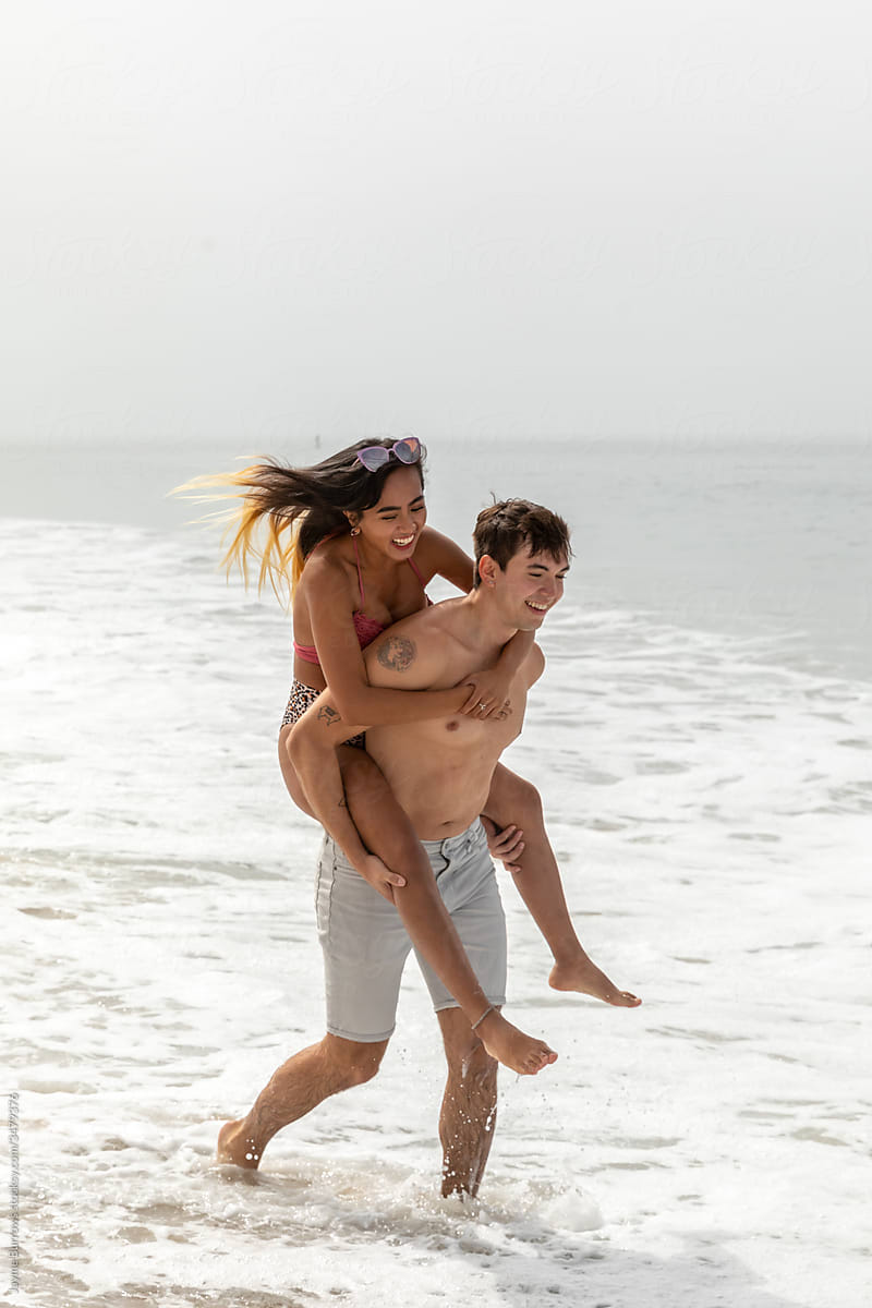 Couple Enjoys the Ocean and Waves