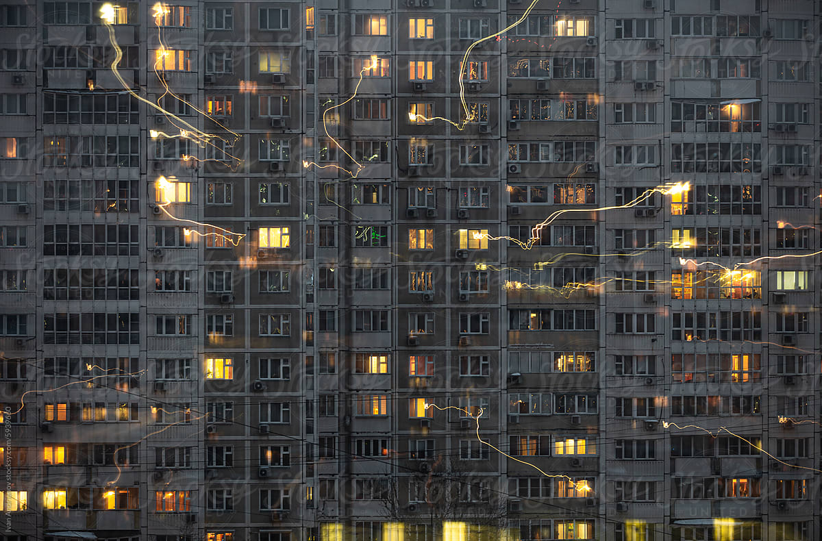 Evening City With Glowing Windows