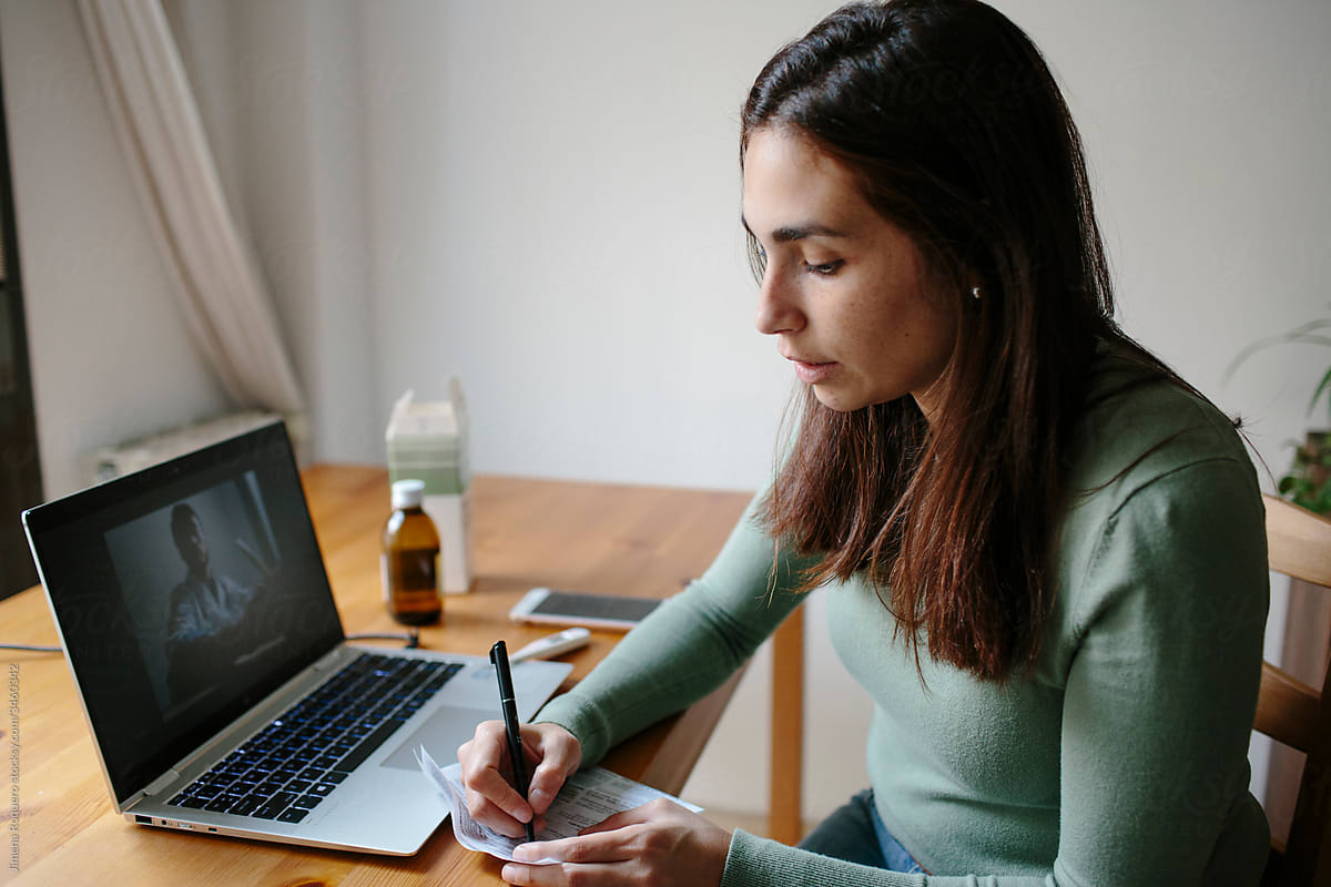 Young woman doing an online consultation with a doctor