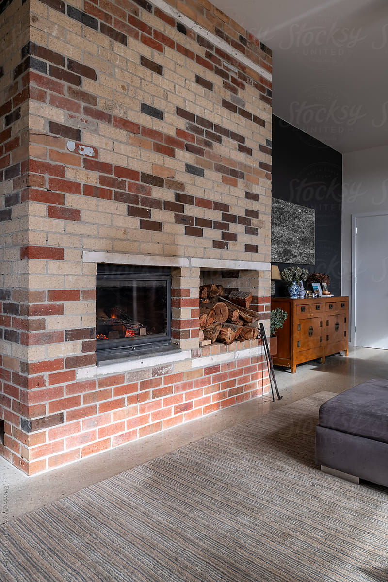 Contemporary home with brick thermal mass designed fireplace
