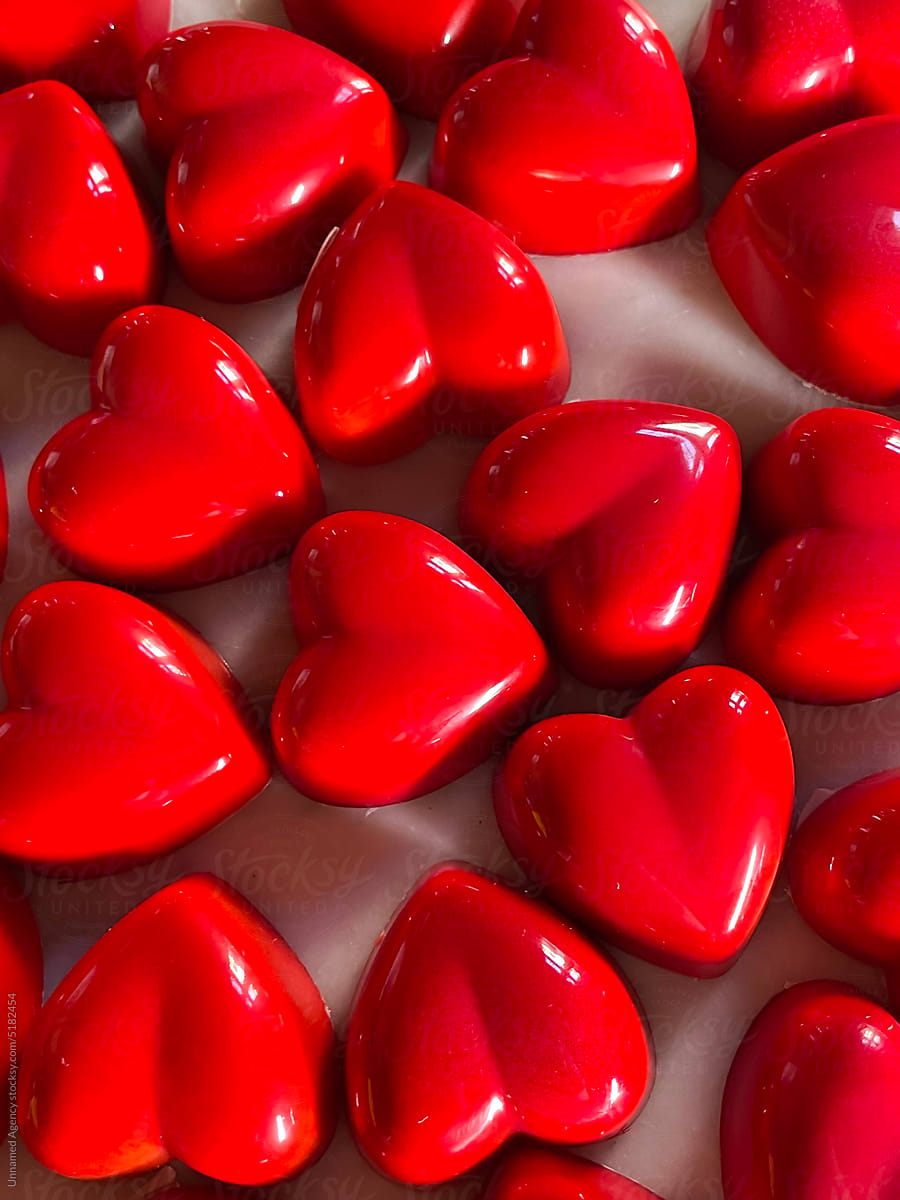 Randomly displayed red heart shaped chocolates