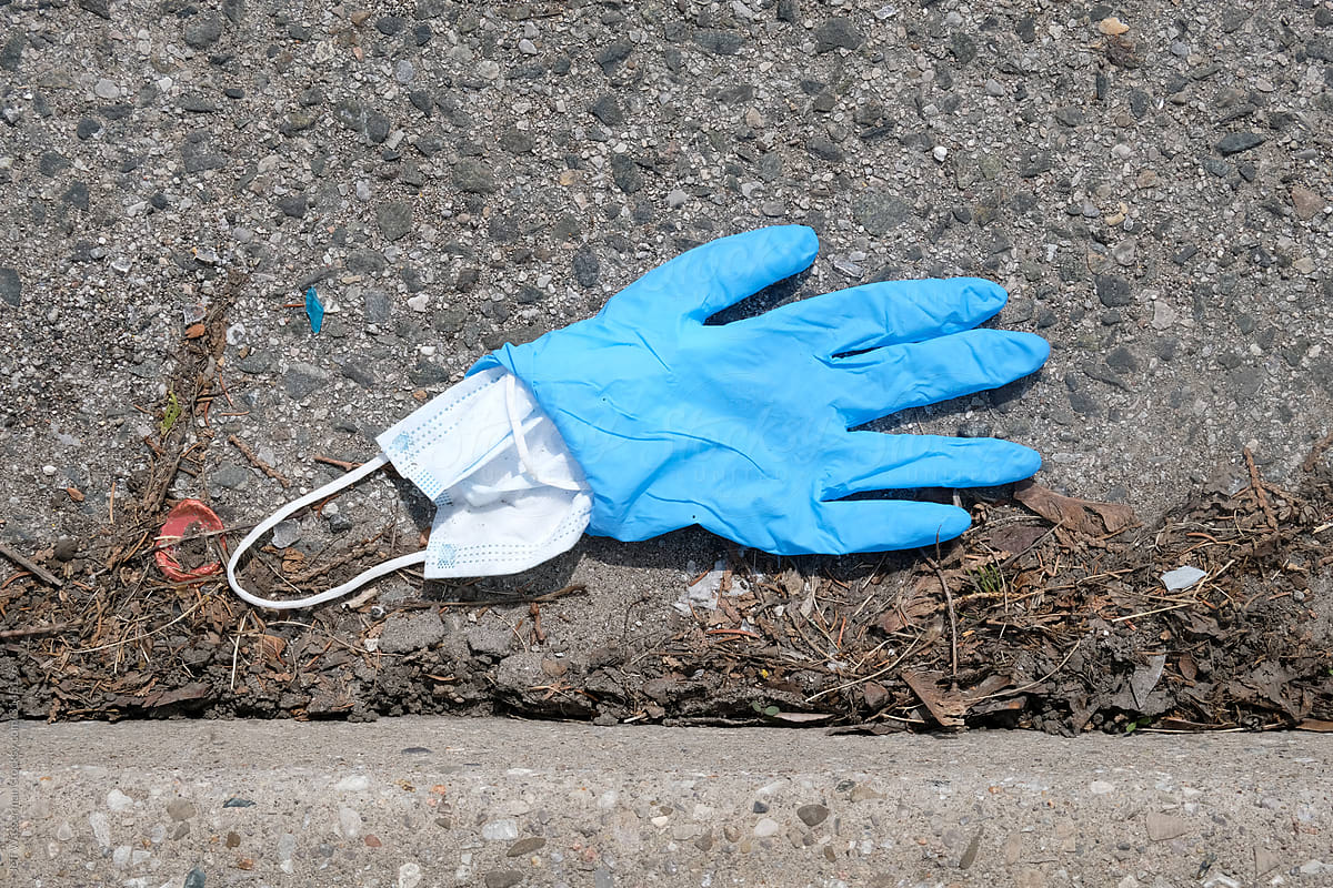 Discarded Medical Mask and Glove on Street