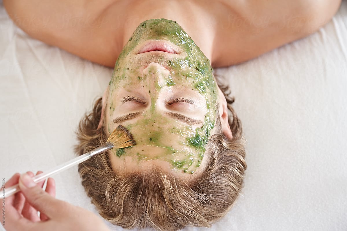 Man receiving an all natural facial at luxury spa