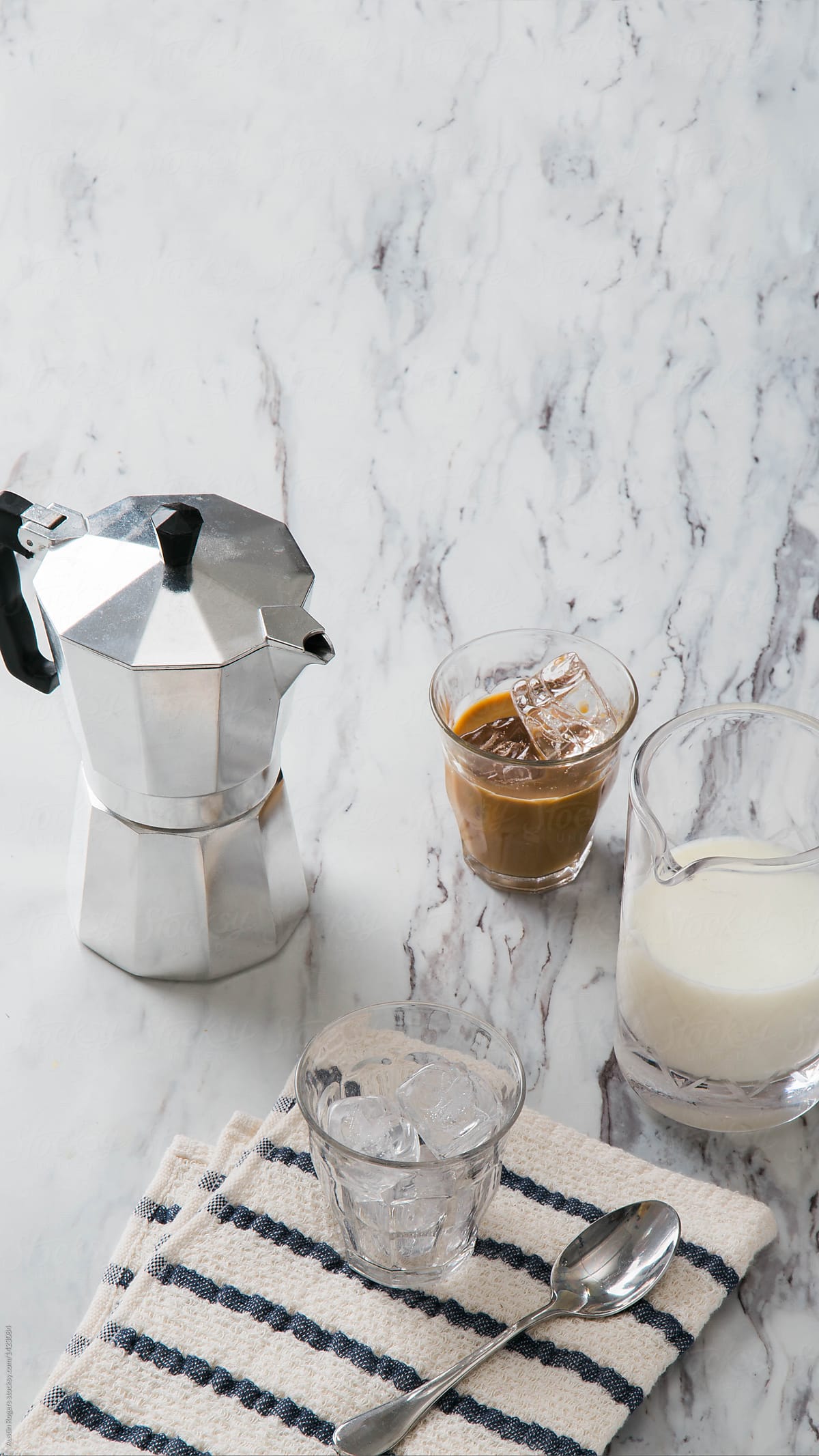Iced Latte Setup on White Marble Countertop