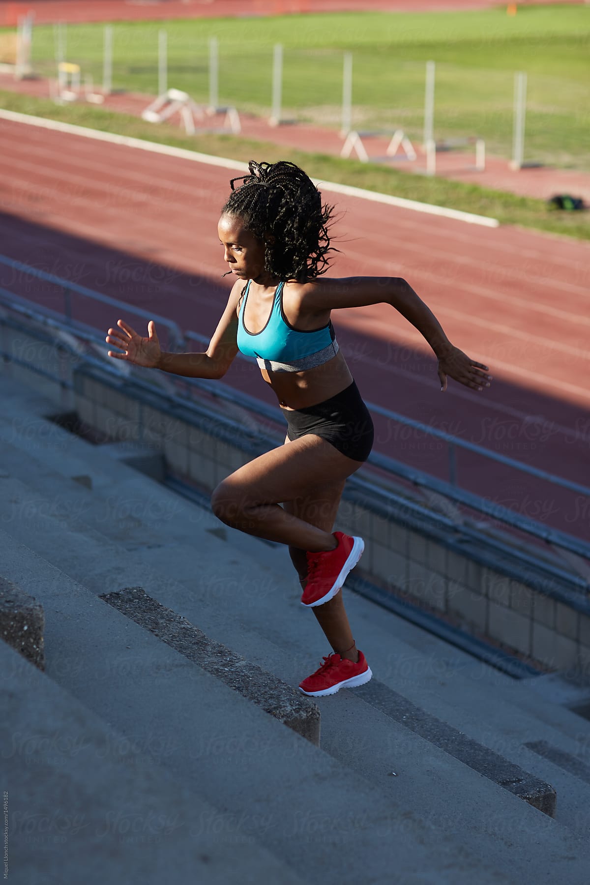 Black athlete steps up with energy in the stadium