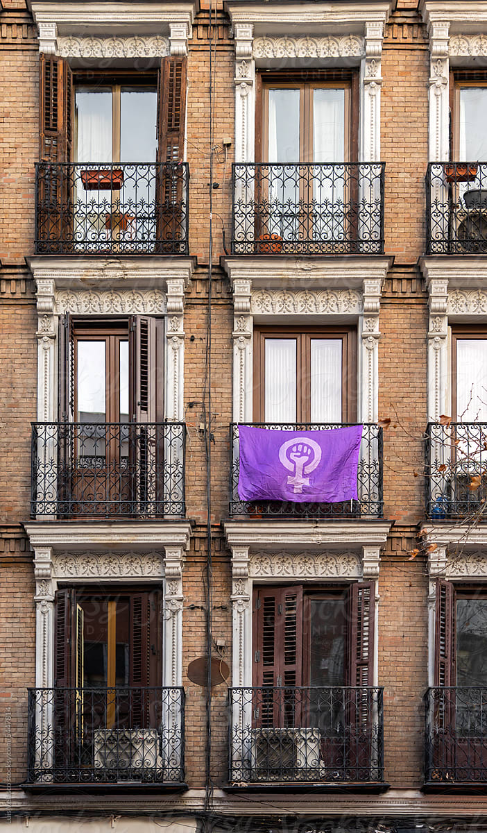 Purple Feminist Symbol On A Facade On The Streets.