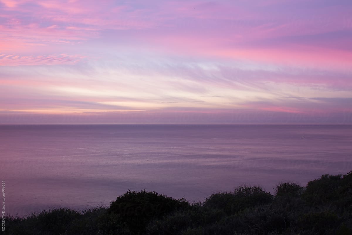 Purple and pink sunrise along the Pacific coast.