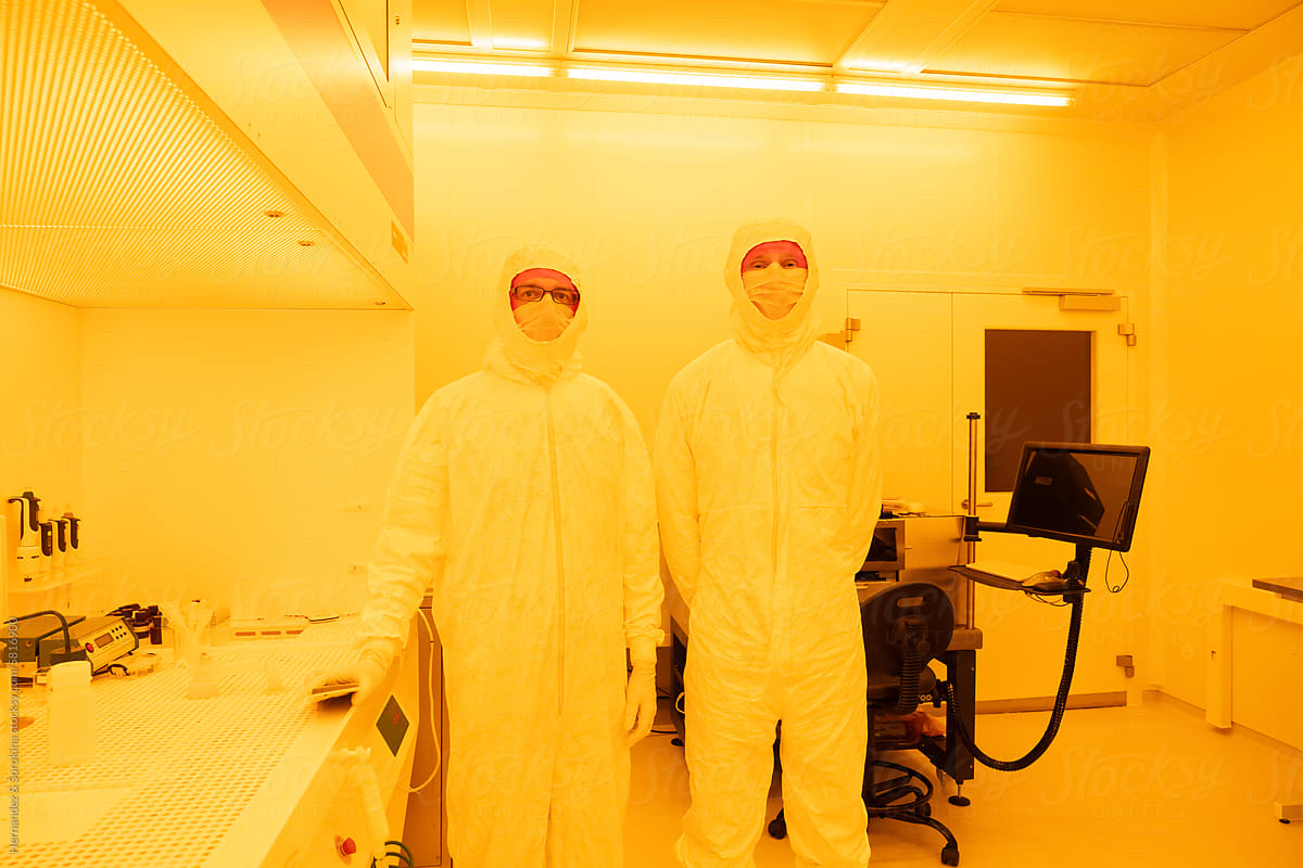 Portrait Of Researchers At Yellow Light Clean Room