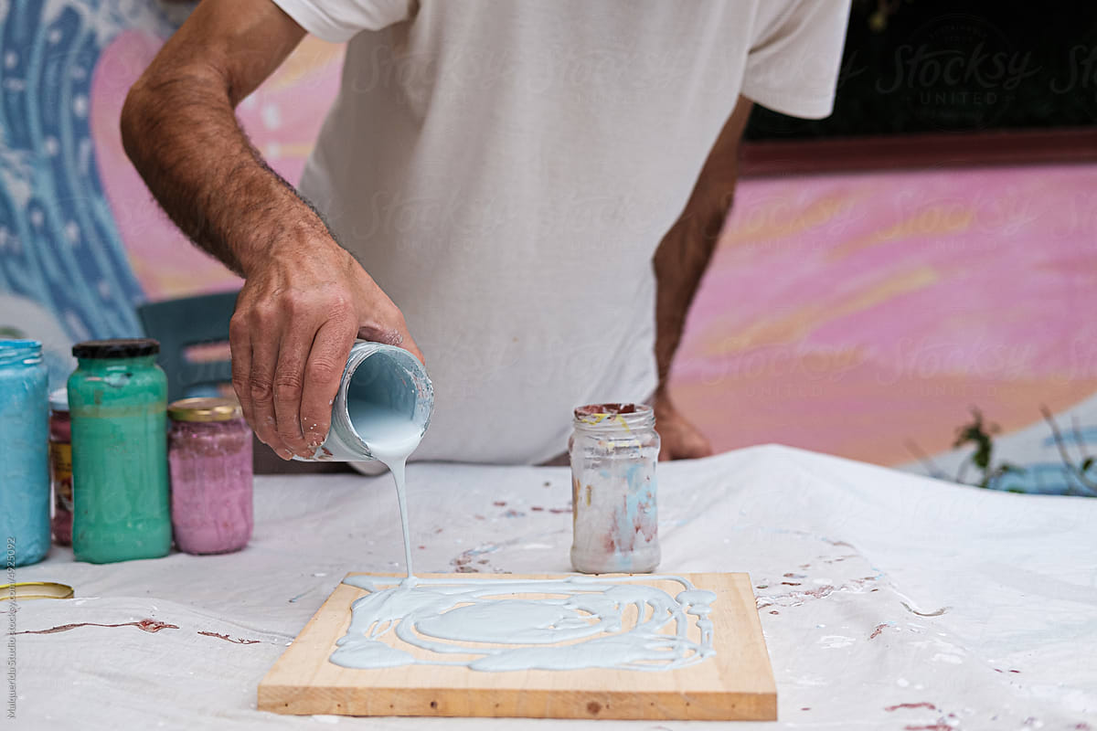 Artist man preparing wood for painting