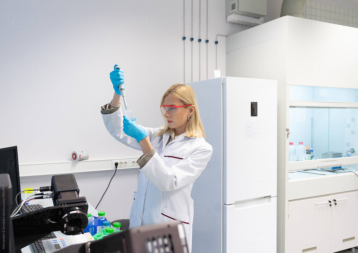 Scientist Working With Sample In Bright Lab Room