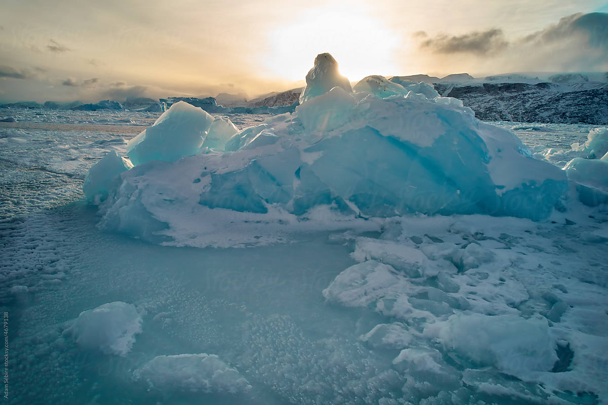 Fragile beauty of Greenlandic iceberg glows in Arctic winter sun
