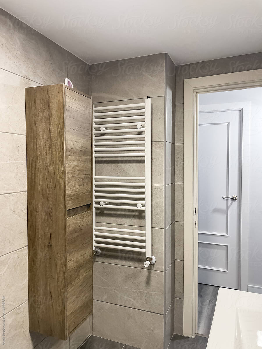 Contemporary bathroom interior with ceramic sink and mirror cabinet