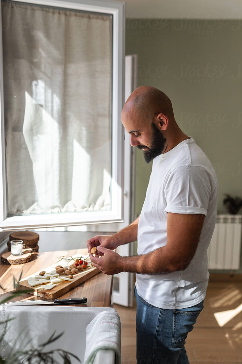 man preparing food at home