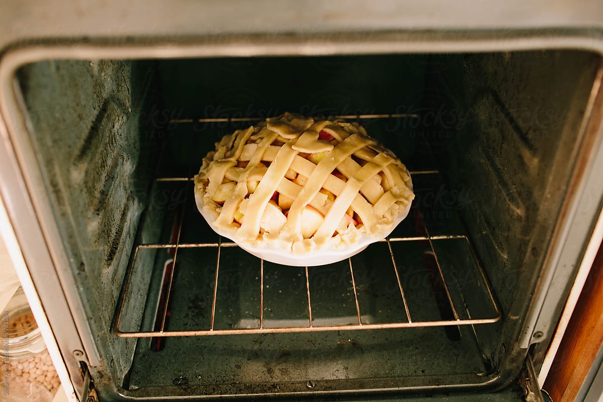 Unbaked pie in white vintage oven
