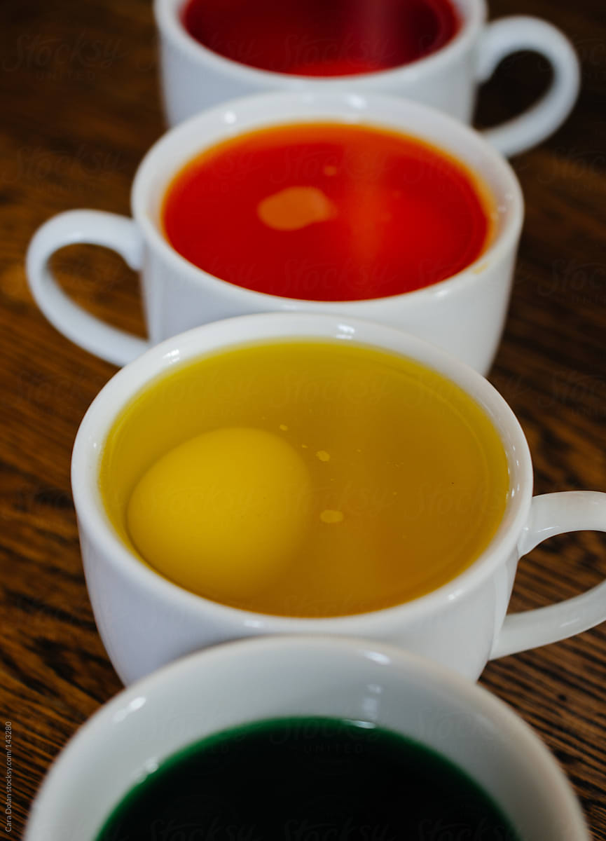 Easter eggs soak in food coloring