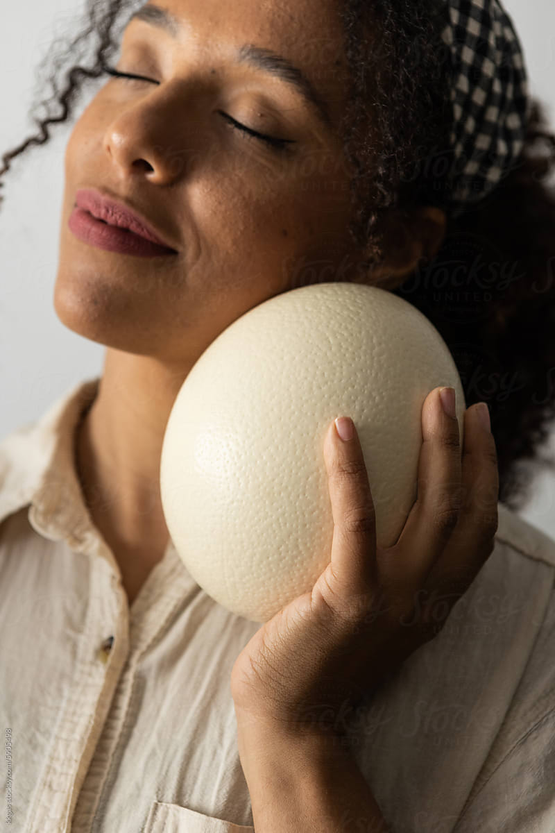 Woman with egg, inner peace exercise