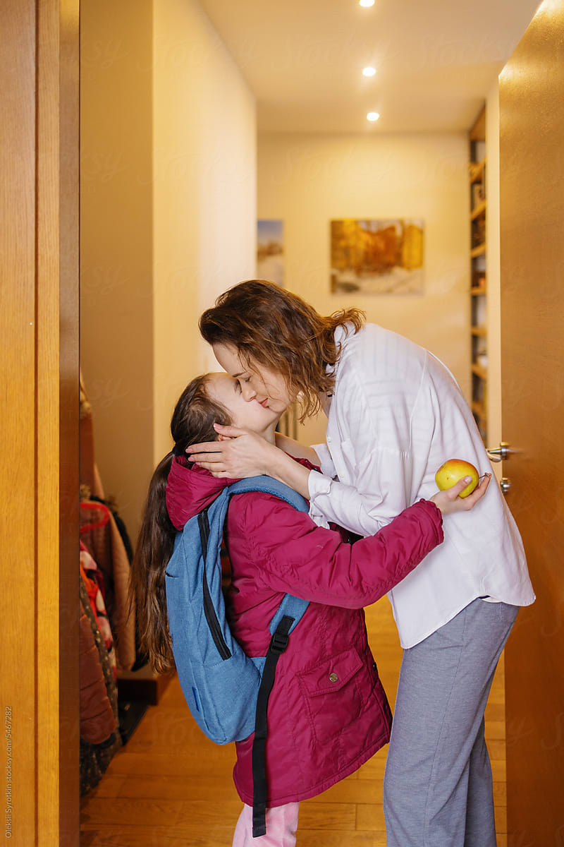 Student kid parent tenderness goodbye connection home