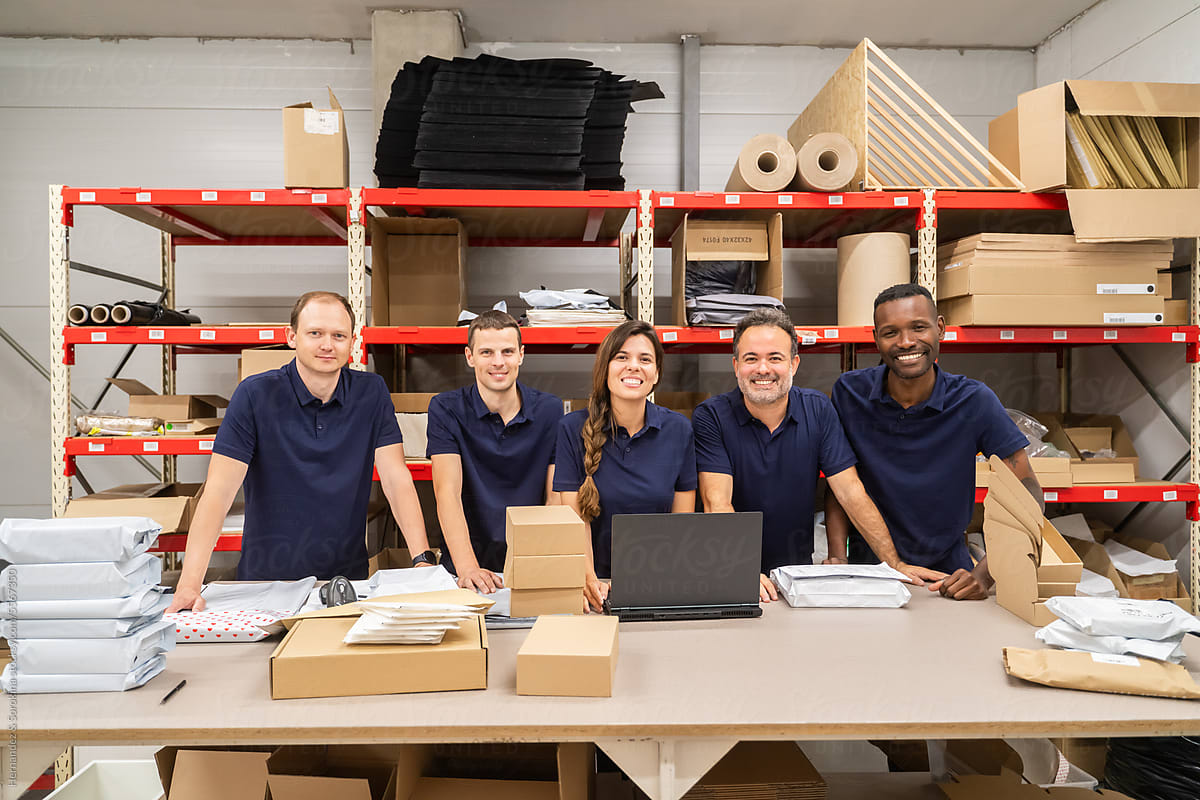 Multiracial Team Of Workers At Packaging Department