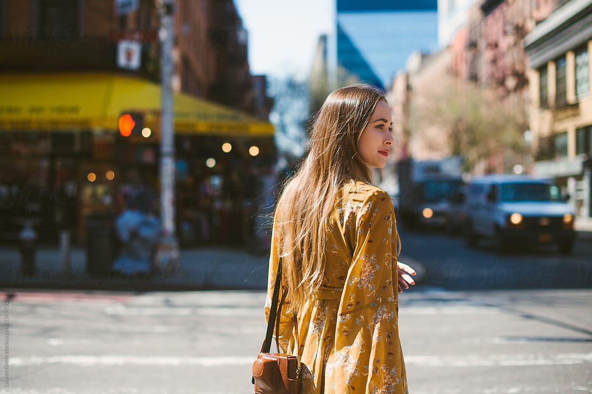 Young woman crossing street in New York City