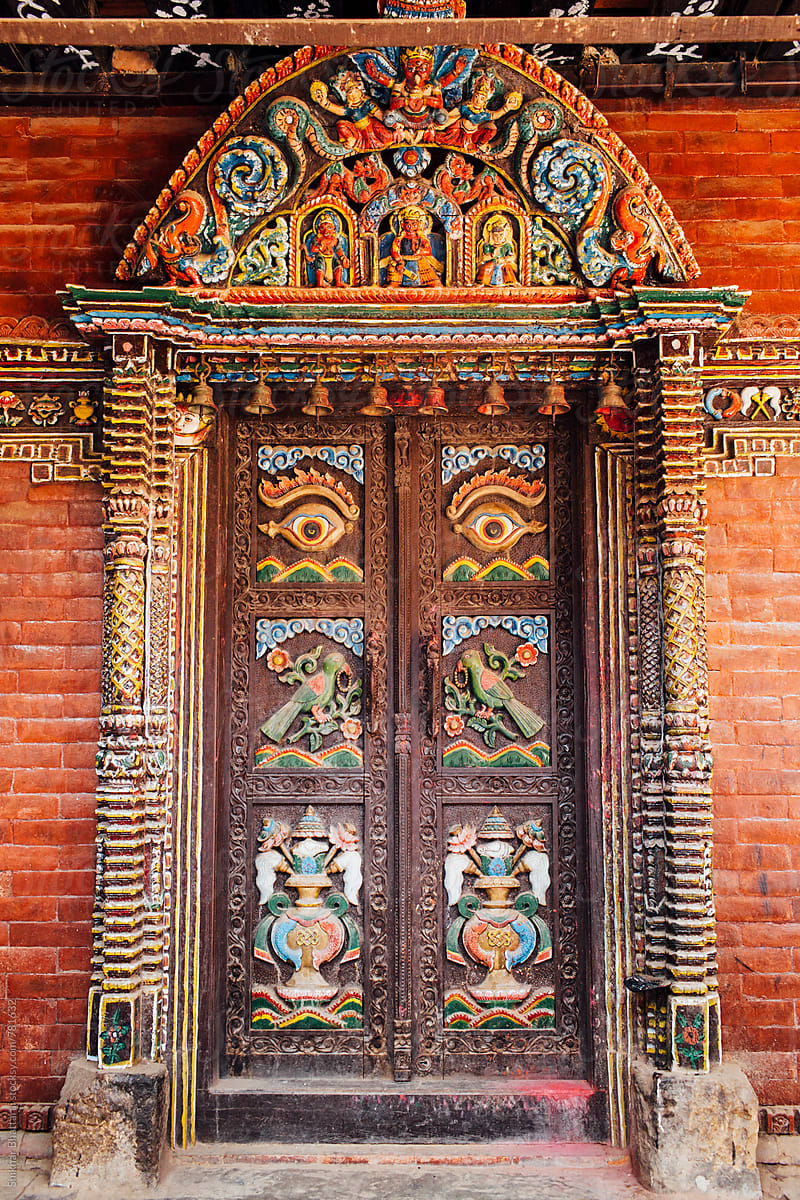 Intricately carved wooden doors in a temple in Kathmandu, Nepal ...