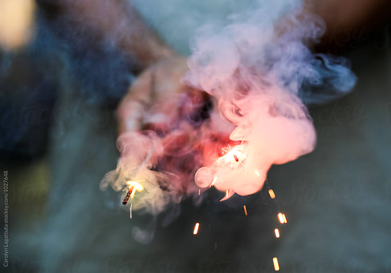 Abstract smoke and an ember in the midst of fireworks