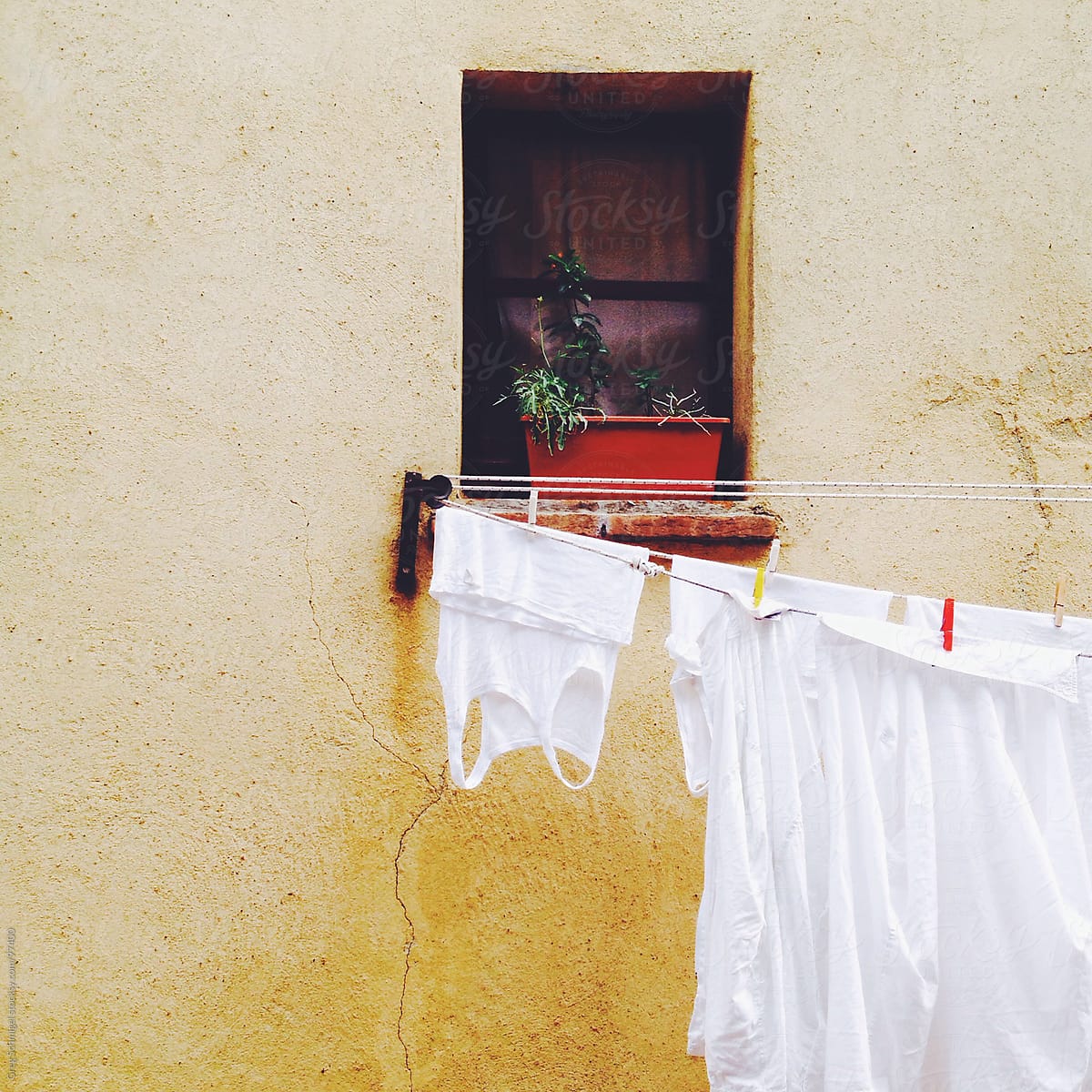 Fresh linens and laundry hanging on a line in Italy